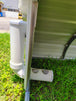 side view of pvc chicken feeder that can be filled from outside of coop